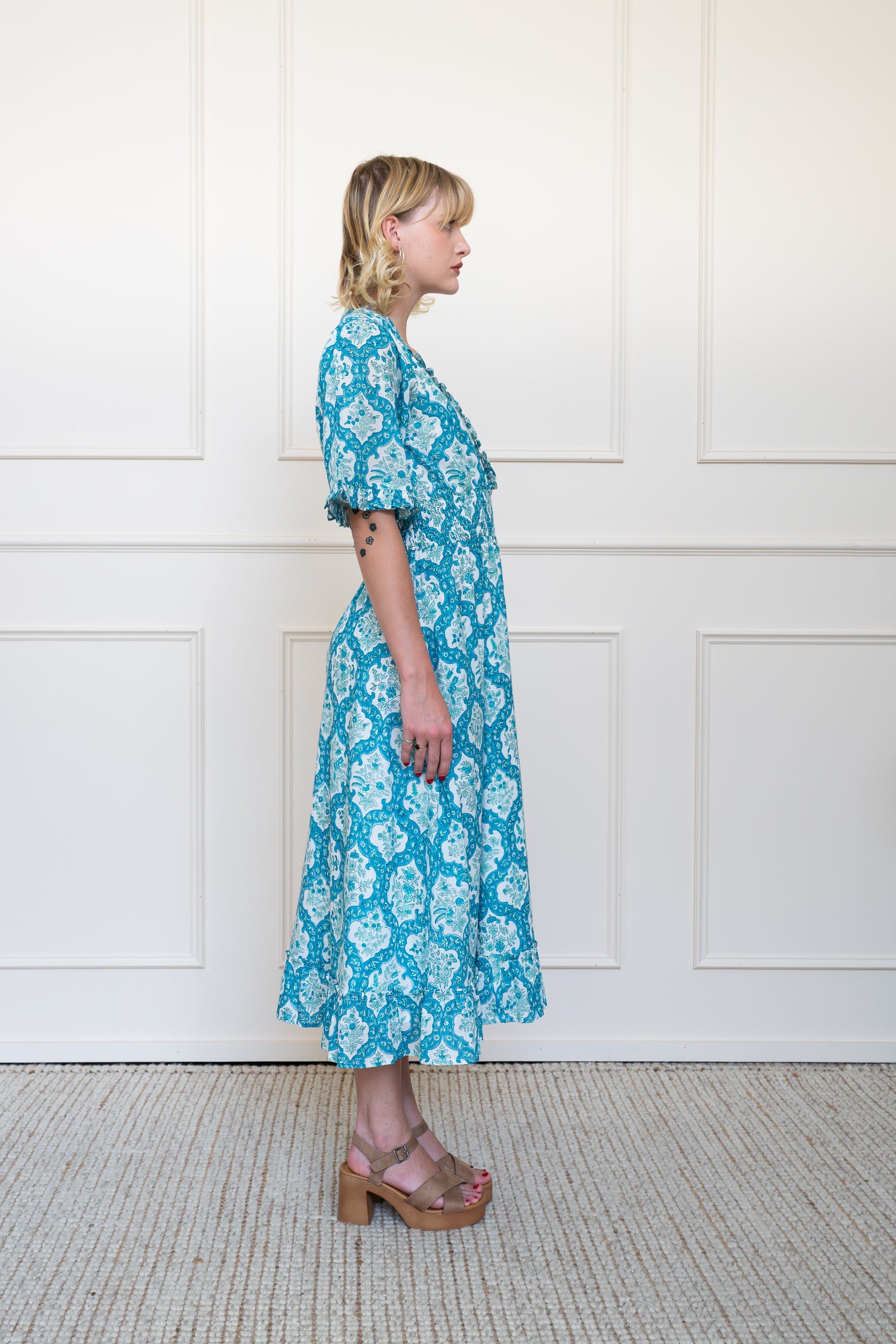 Side view of Airlie Dress in Blue showing floral hand block print pattern and relaxed summer styling.
