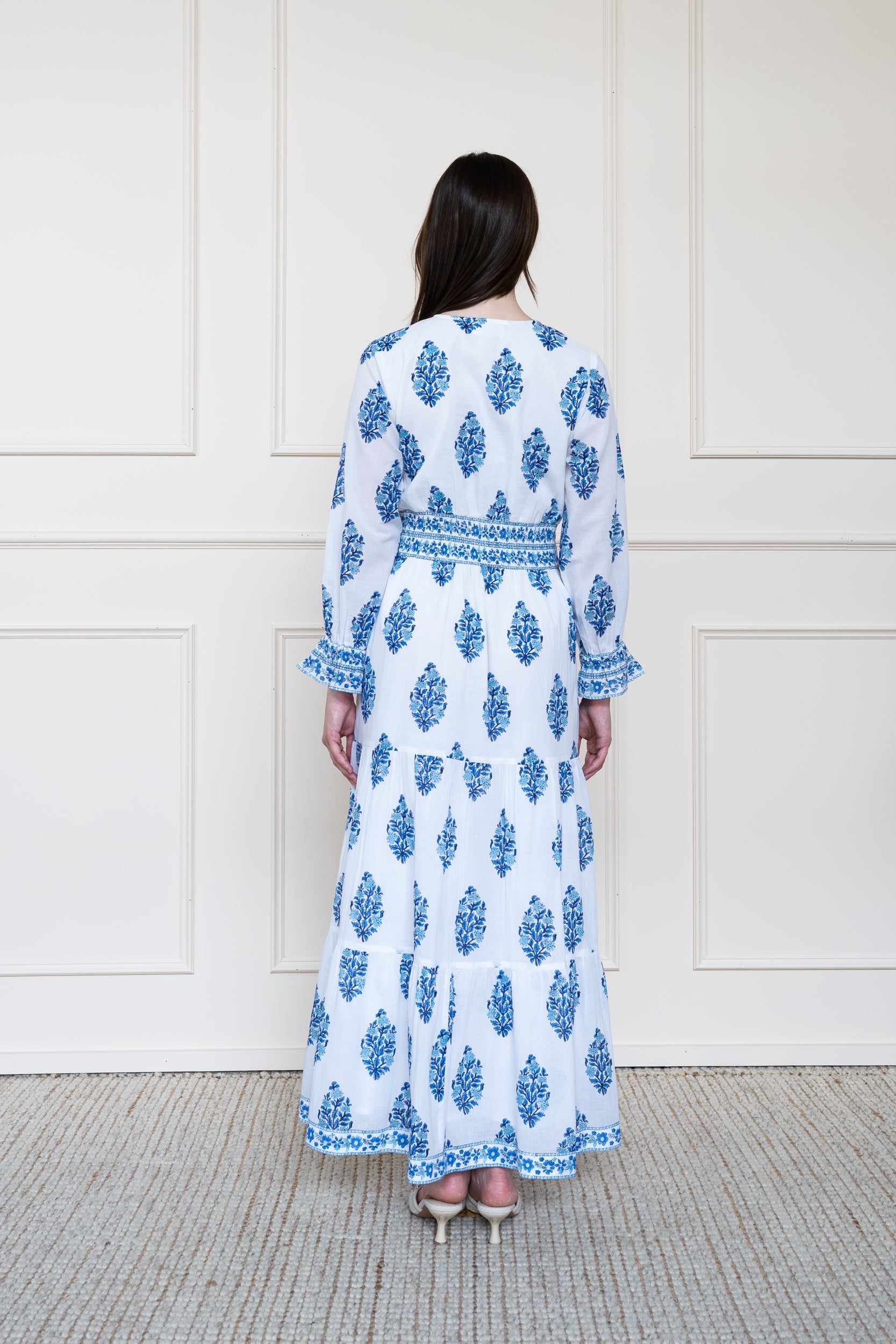 Back view of Atherton Dress in blue botanicals showing relaxed fit and breathable Indian organic cotton fabric.