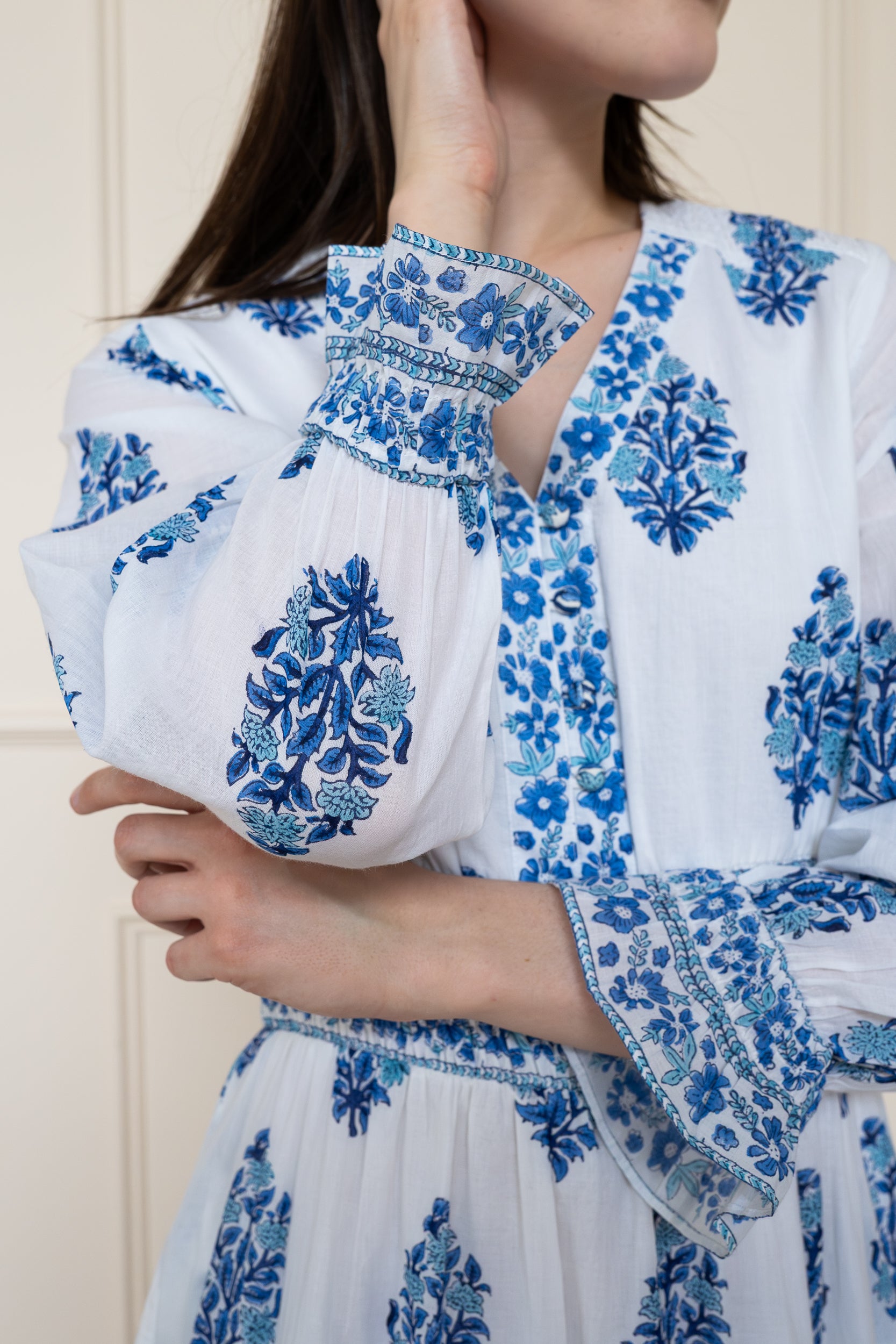Close up of Atherton Dress sleeve cuff showing sophisticated floral print and breathable soft organic cotton texture.