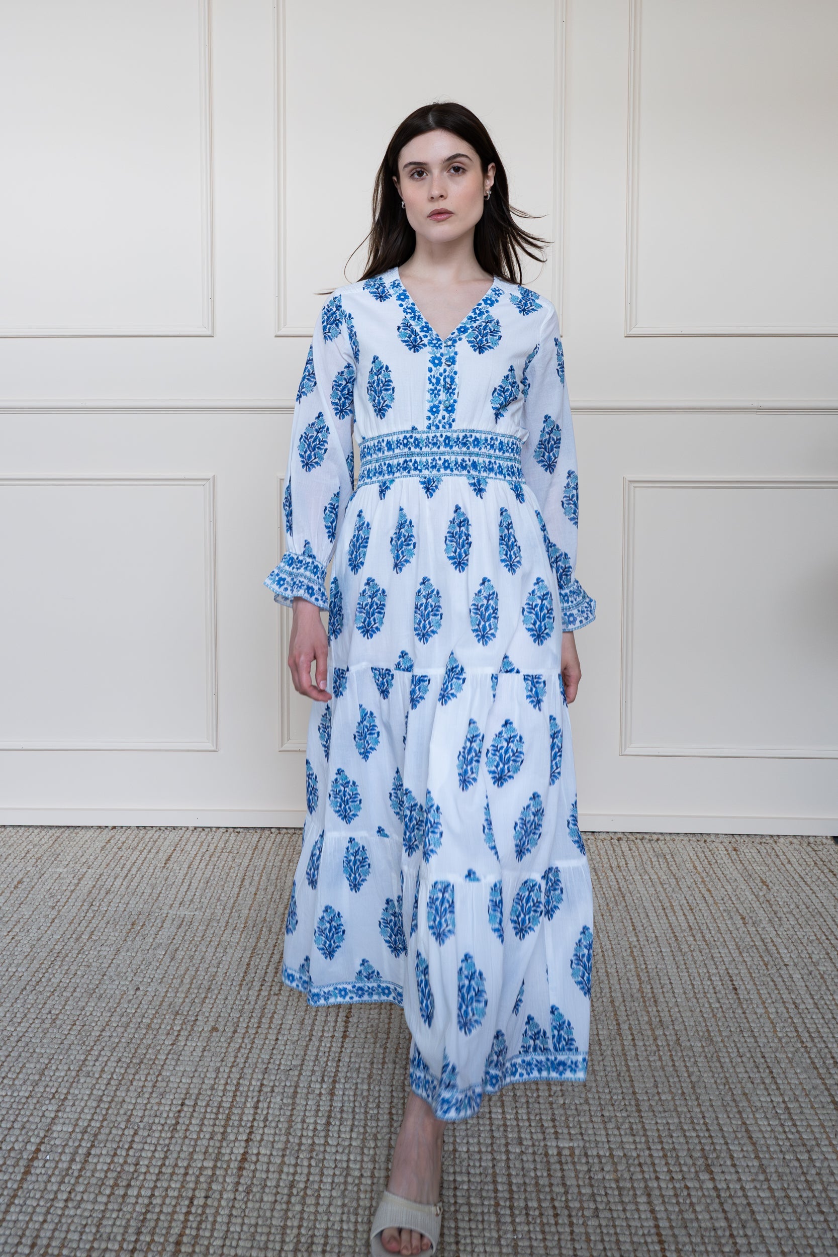 Atherton Dress in blue botanicals showing voluminous tiered skirt flare and smocked waist fit for comfort.