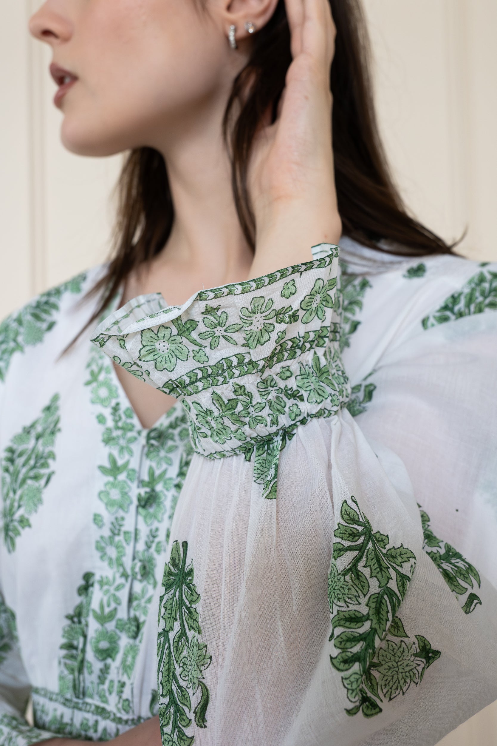 Close up of Atherton Dress sleeve cuff showing sophisticated floral print and breathable soft organic cotton texture.