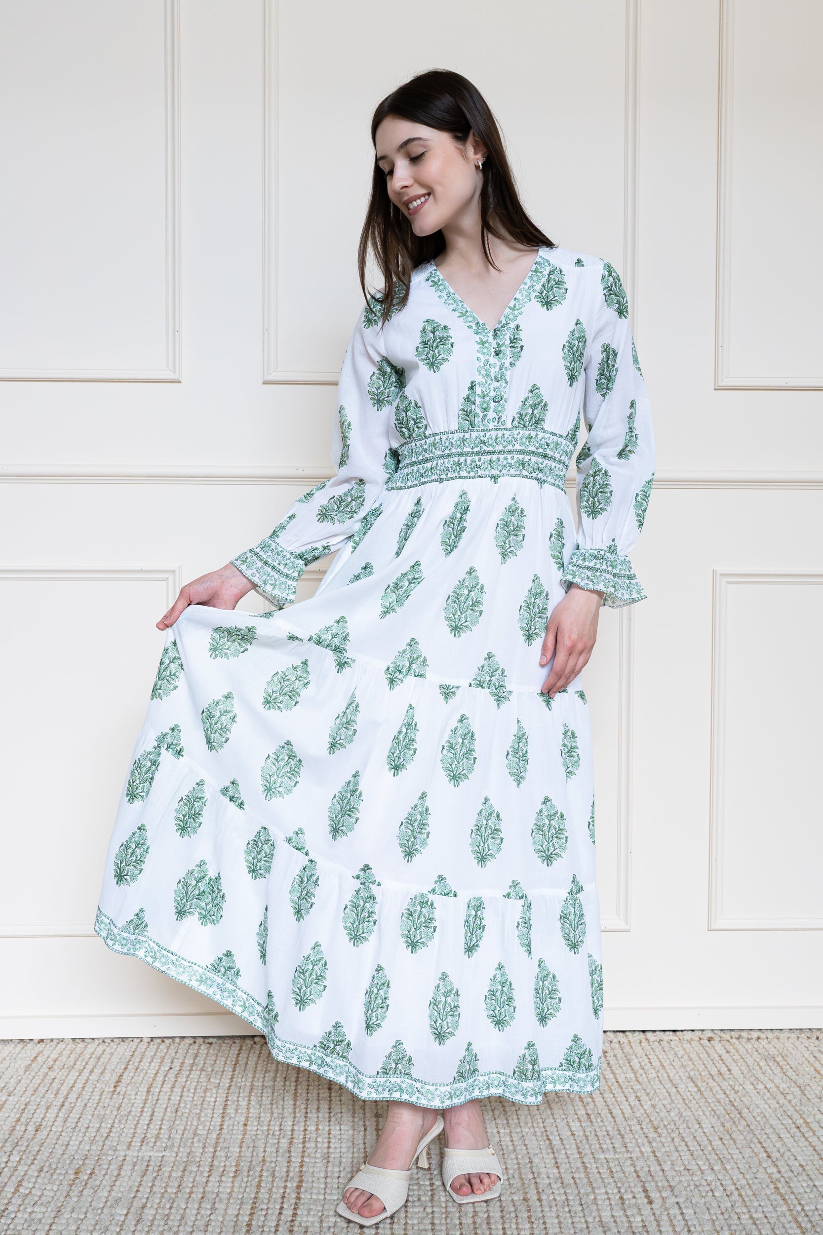 Atherton Dress in Green Botanicals showing voluminous tiered skirt flare and smocked waist fit for comfort.