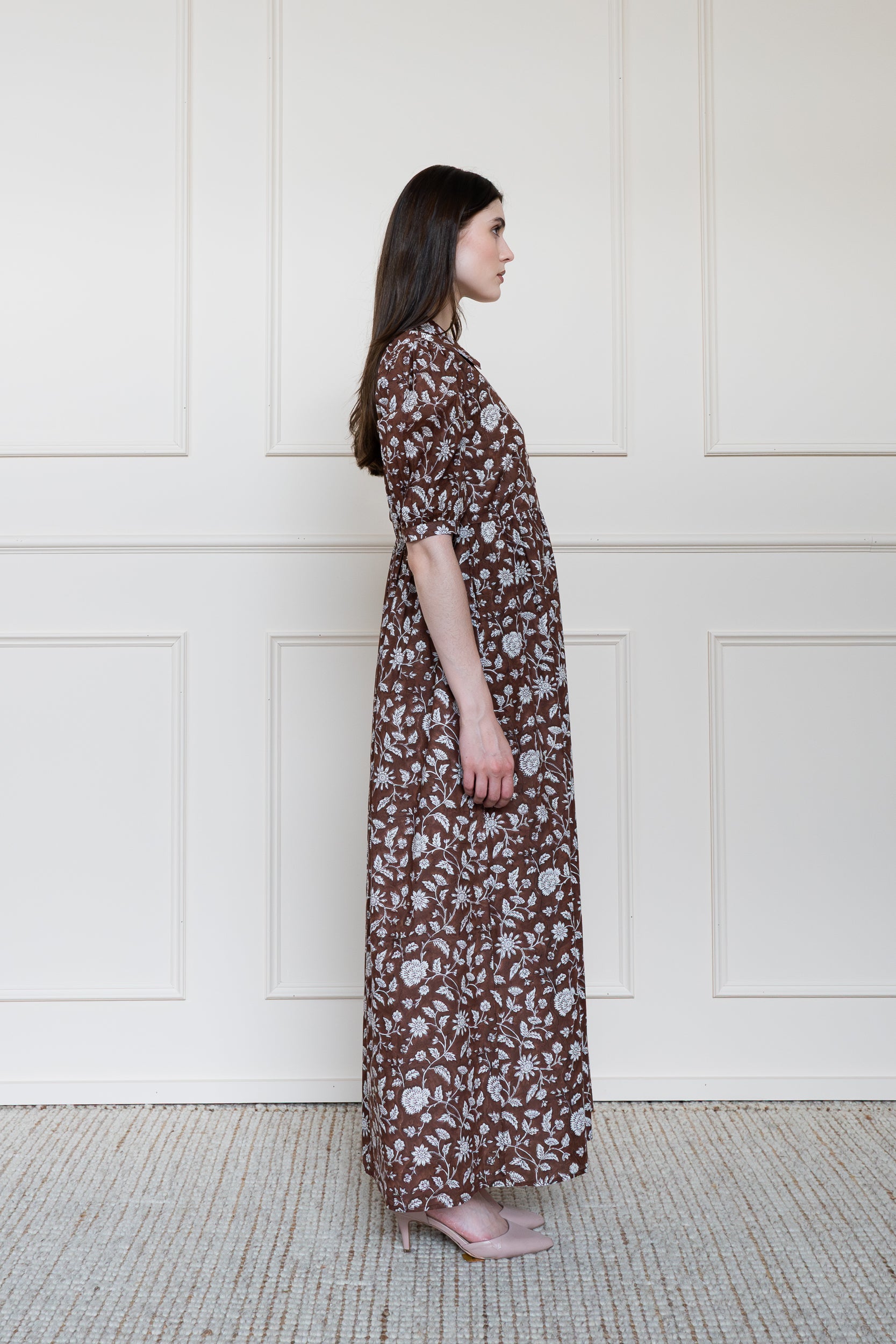 Side profile of Balmoral Dress showing elbow length sleeves and modest maxi length fit.