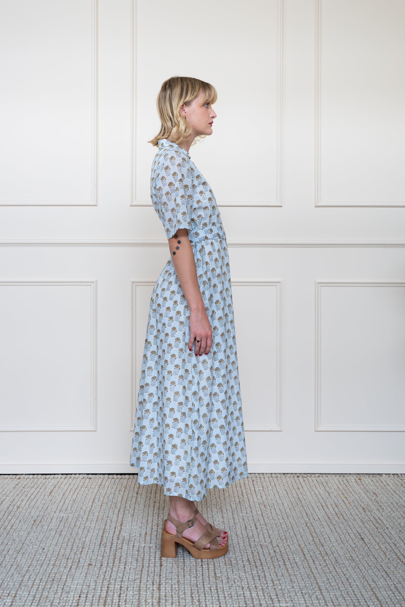 Side profile of Bowral Dress showing elbow length sleeves and modest maxi length fit.