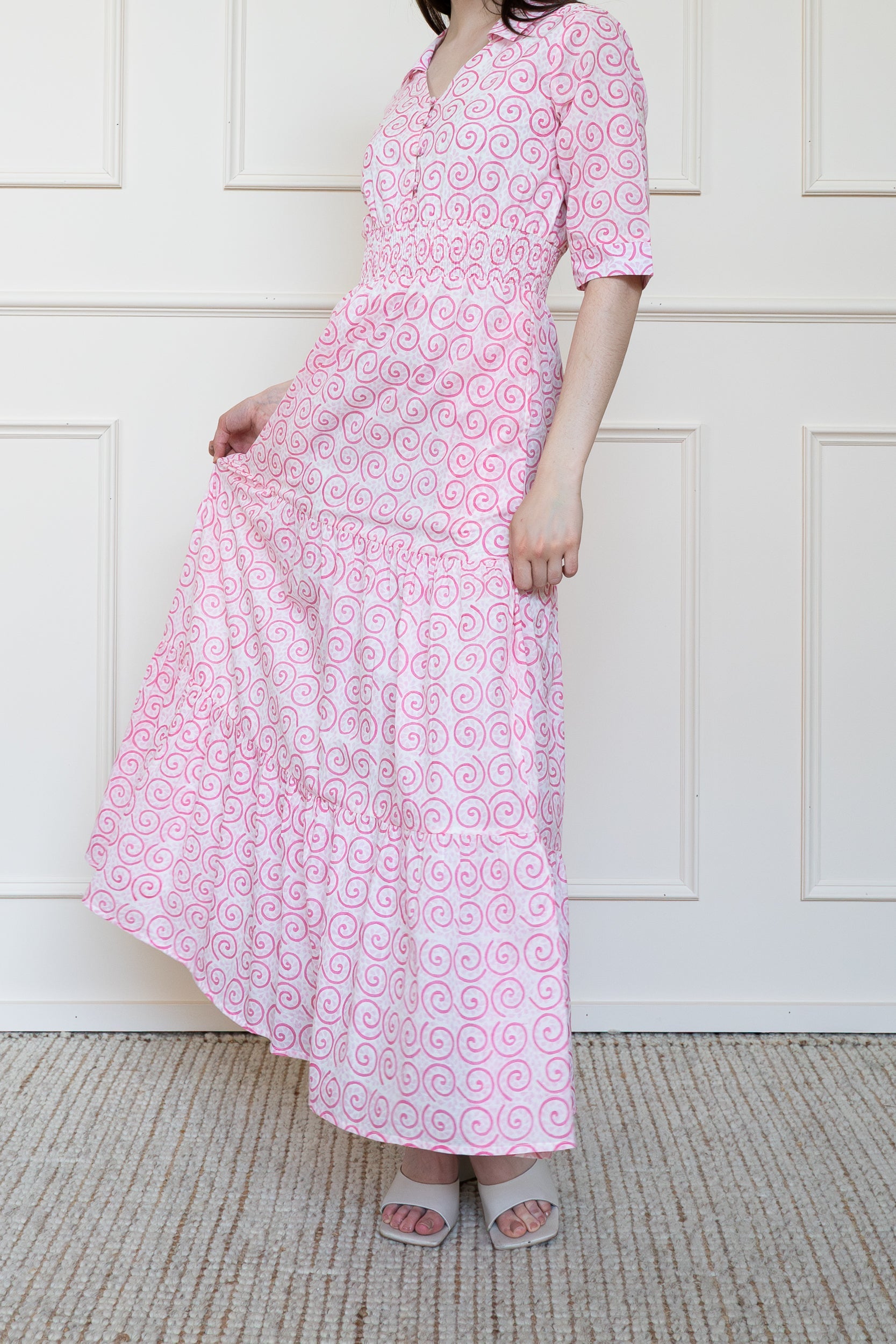 Byron Bay Dress in Desert Rose Pink showing voluminous tiered skirt flare and smocked waist fit for comfort.