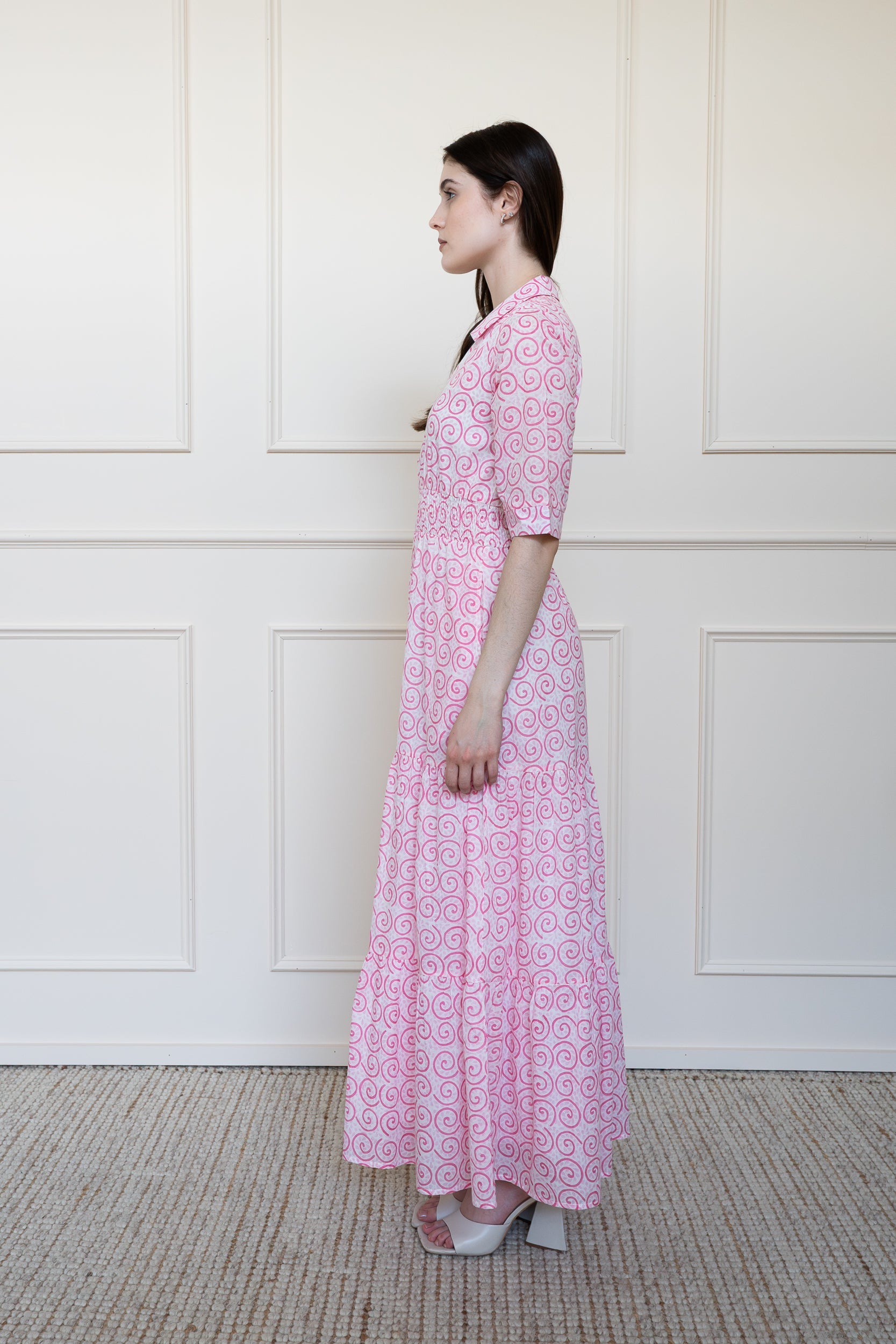 Side view of Byron Bay Dress in pink styling for wedding guest dress Australia.