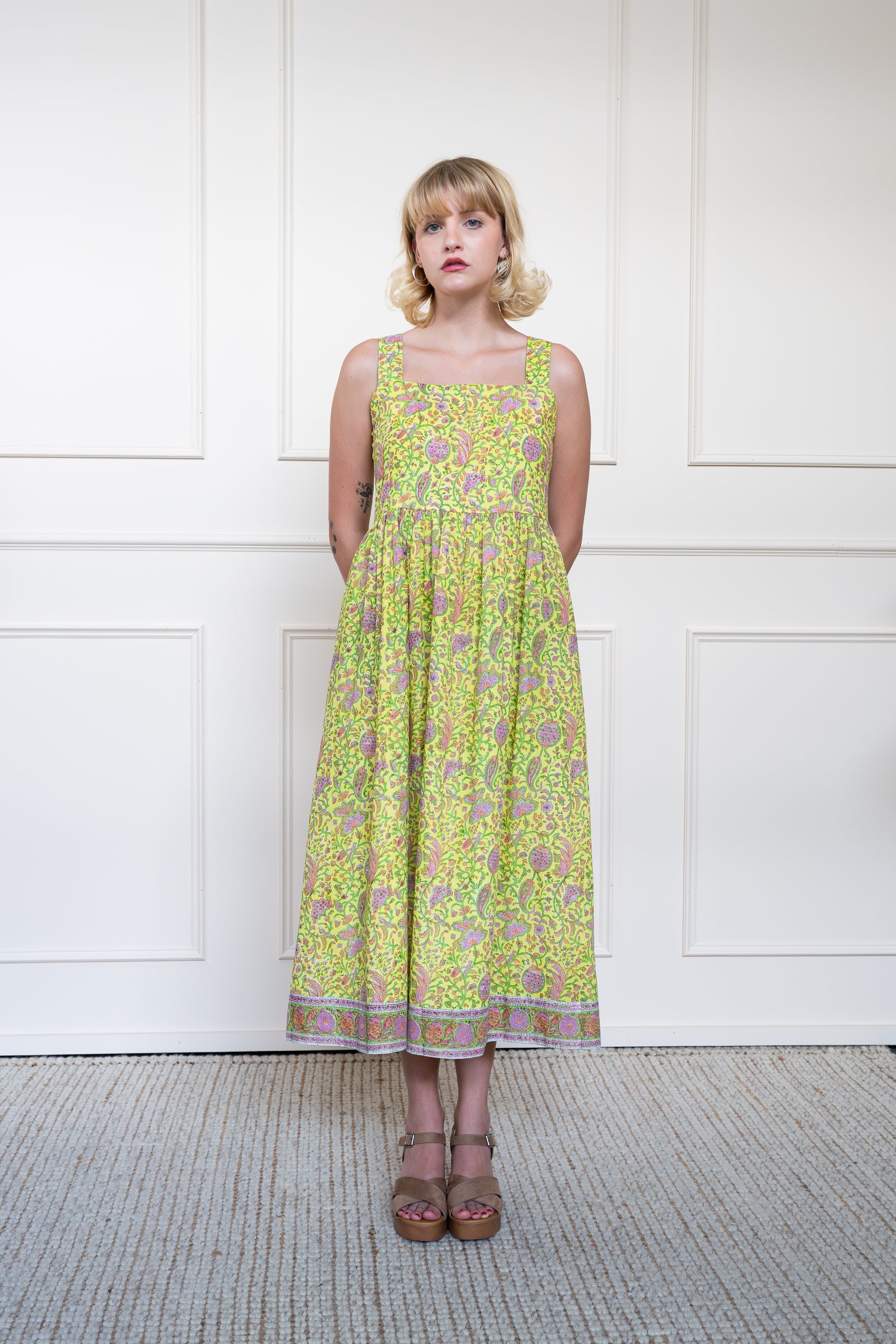 Cairns Dress in Lemon Myrtle showing flowing midi skirt suitable for summer garden party or day events.