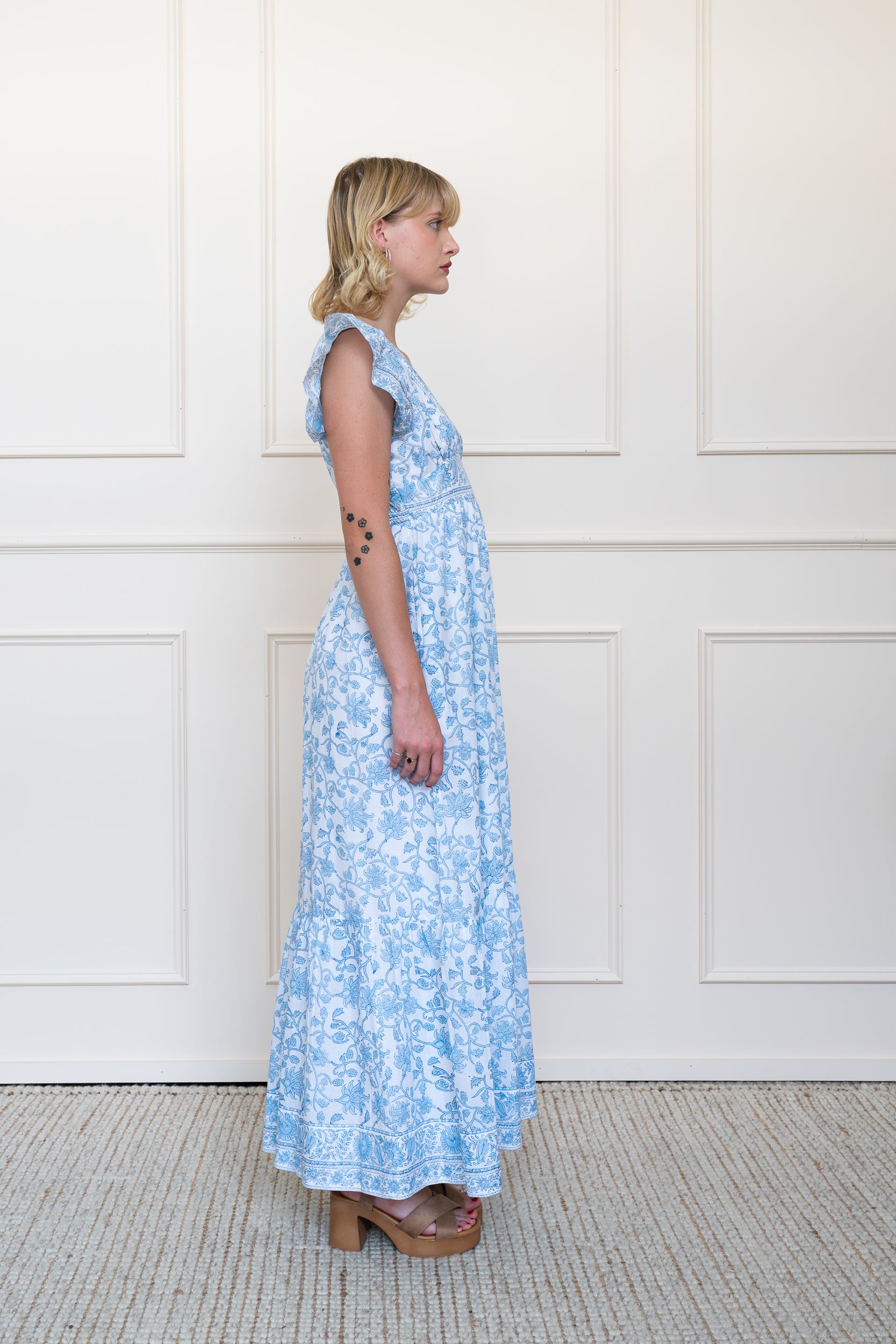 Side profile of Daintree Dress in Blue Floral showing sleeve length and modest maxi length fit.