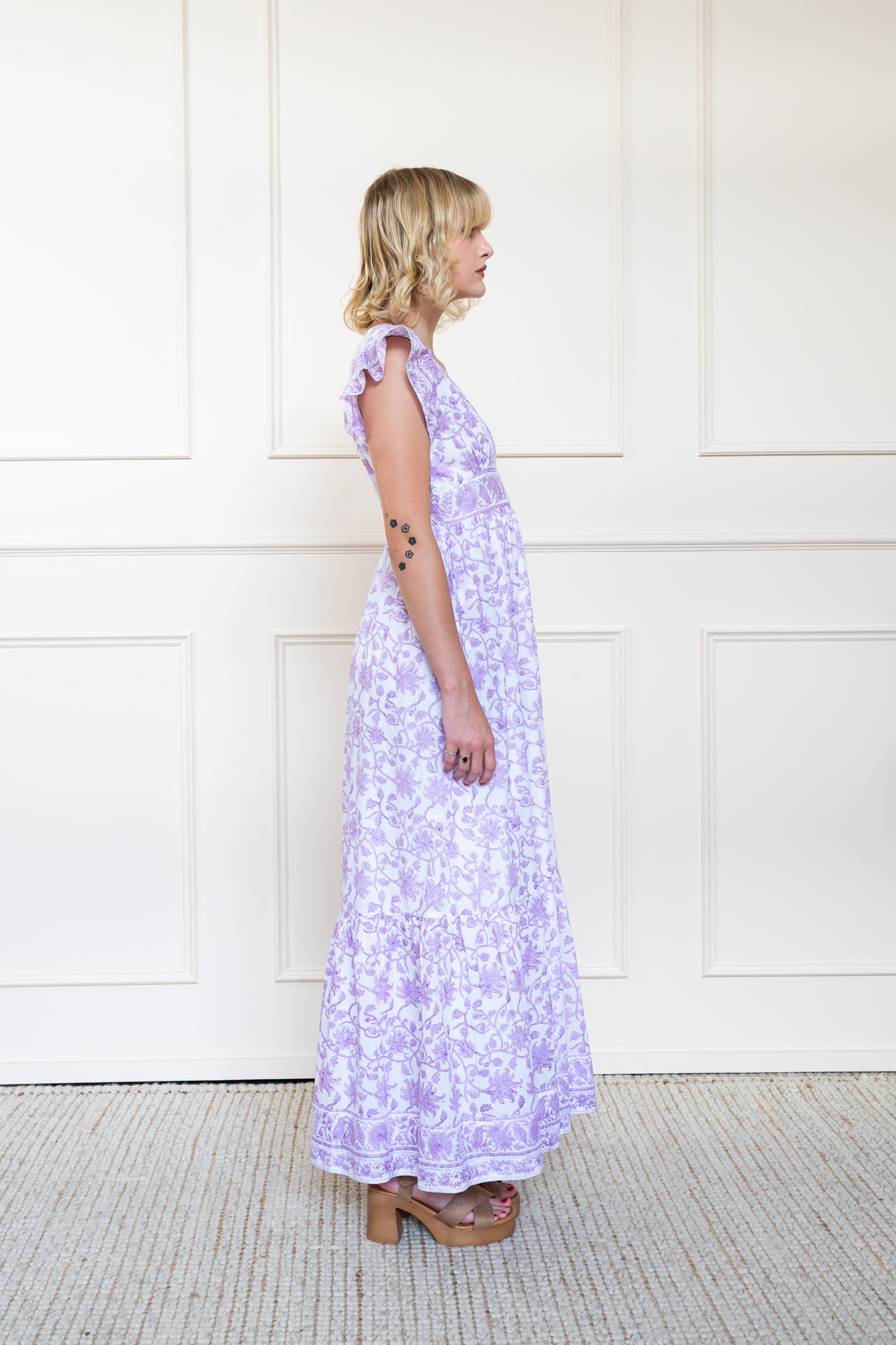 Side profile of Daintree Dress in Orchid Bloom showing sleeve style and modest maxi length fit.