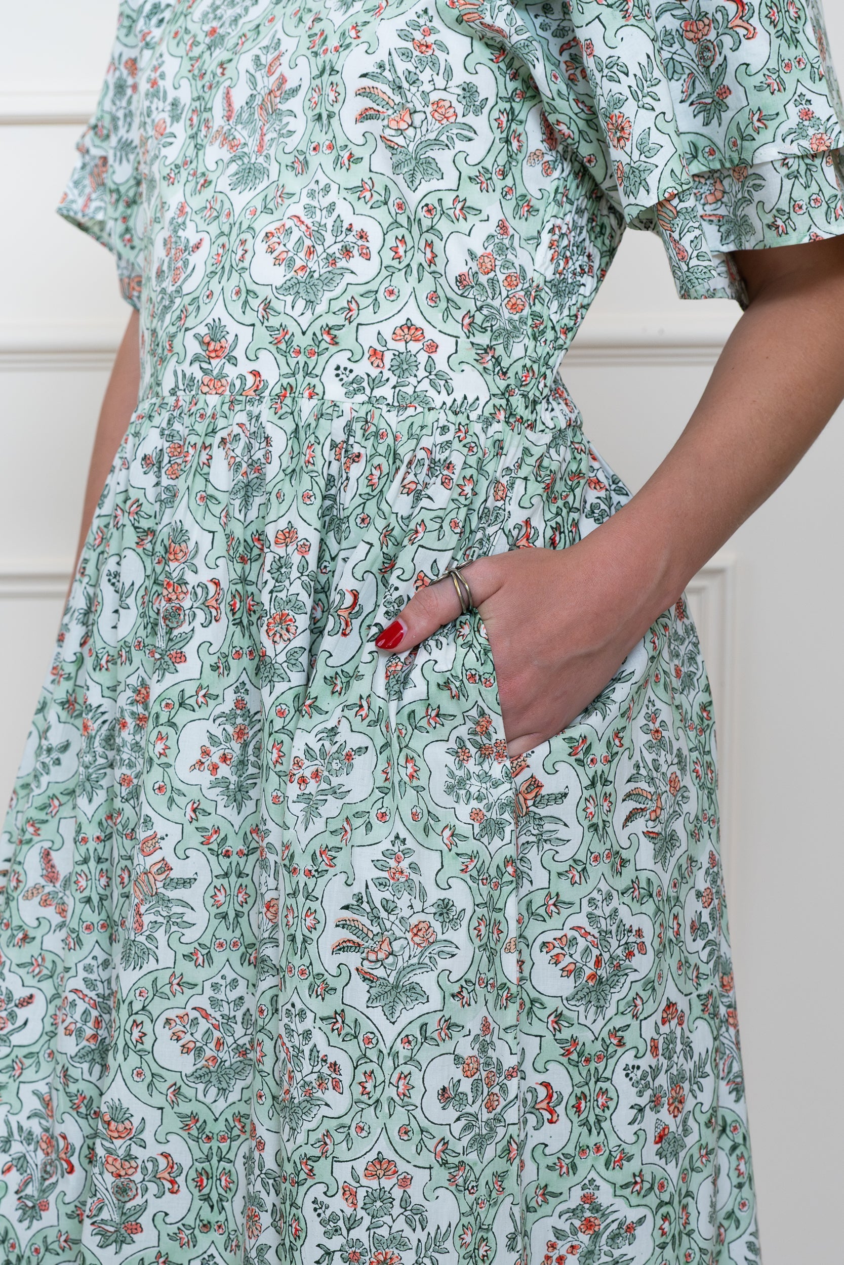 Detail view of Grampians Dress in green showing deep functional side pockets for practical everyday wear.