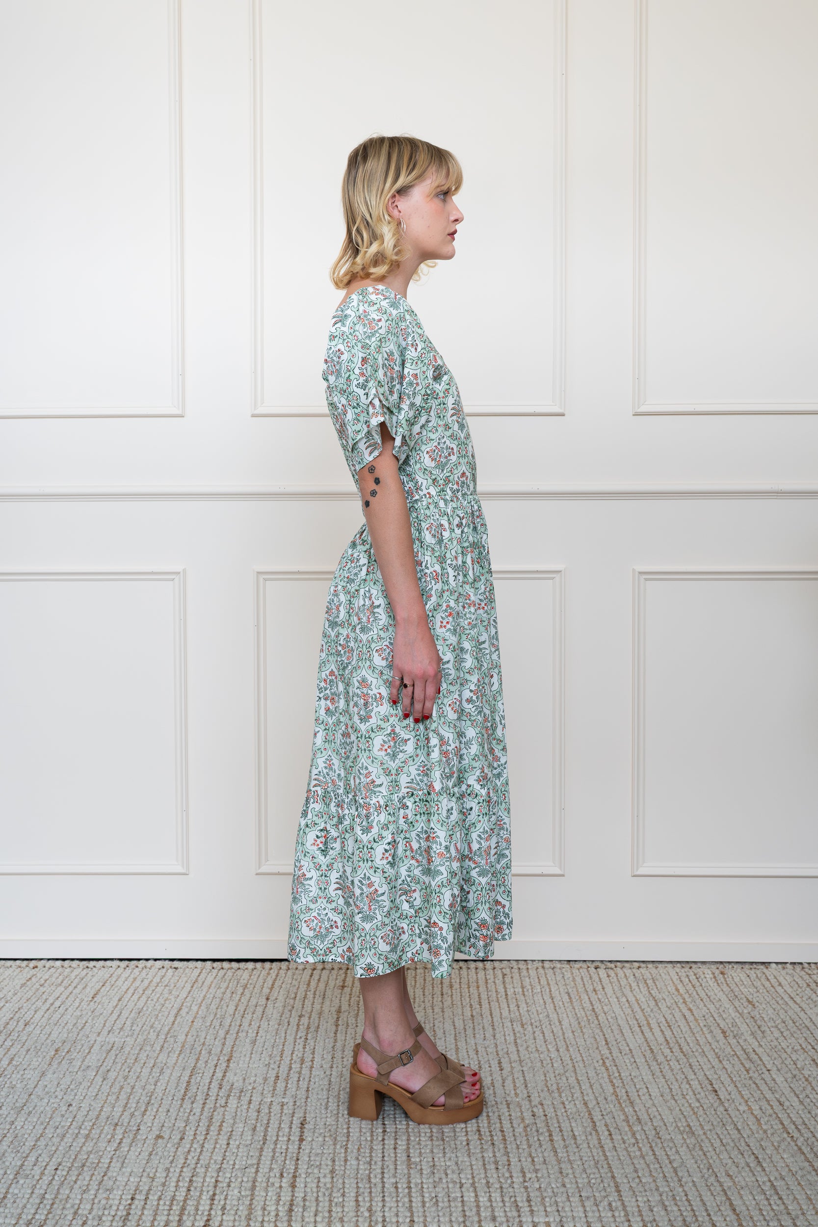 Side profile of Grampians Dress in Sage Green showing midi length hem and relaxed summer fit.