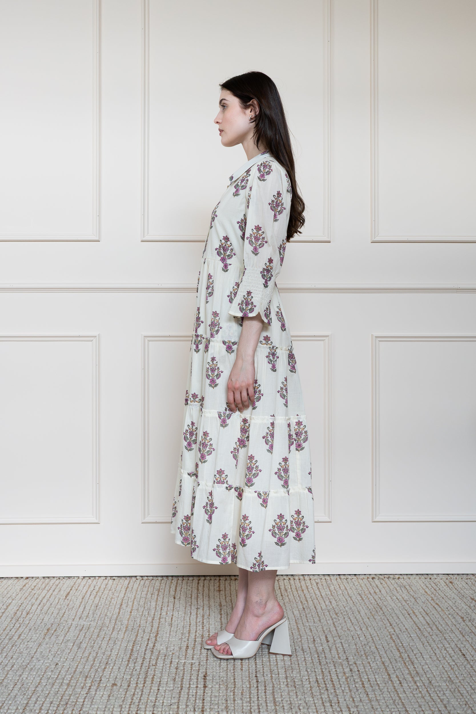 Side profile of Noosa Dress showing elbow length sleeves and modest midi length fit.