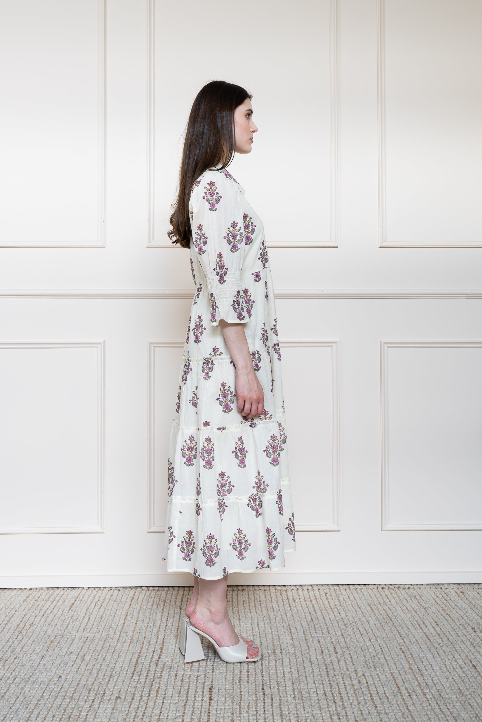 Side profile of Noosa Dress showing elbow length sleeves and modest midi length fit.