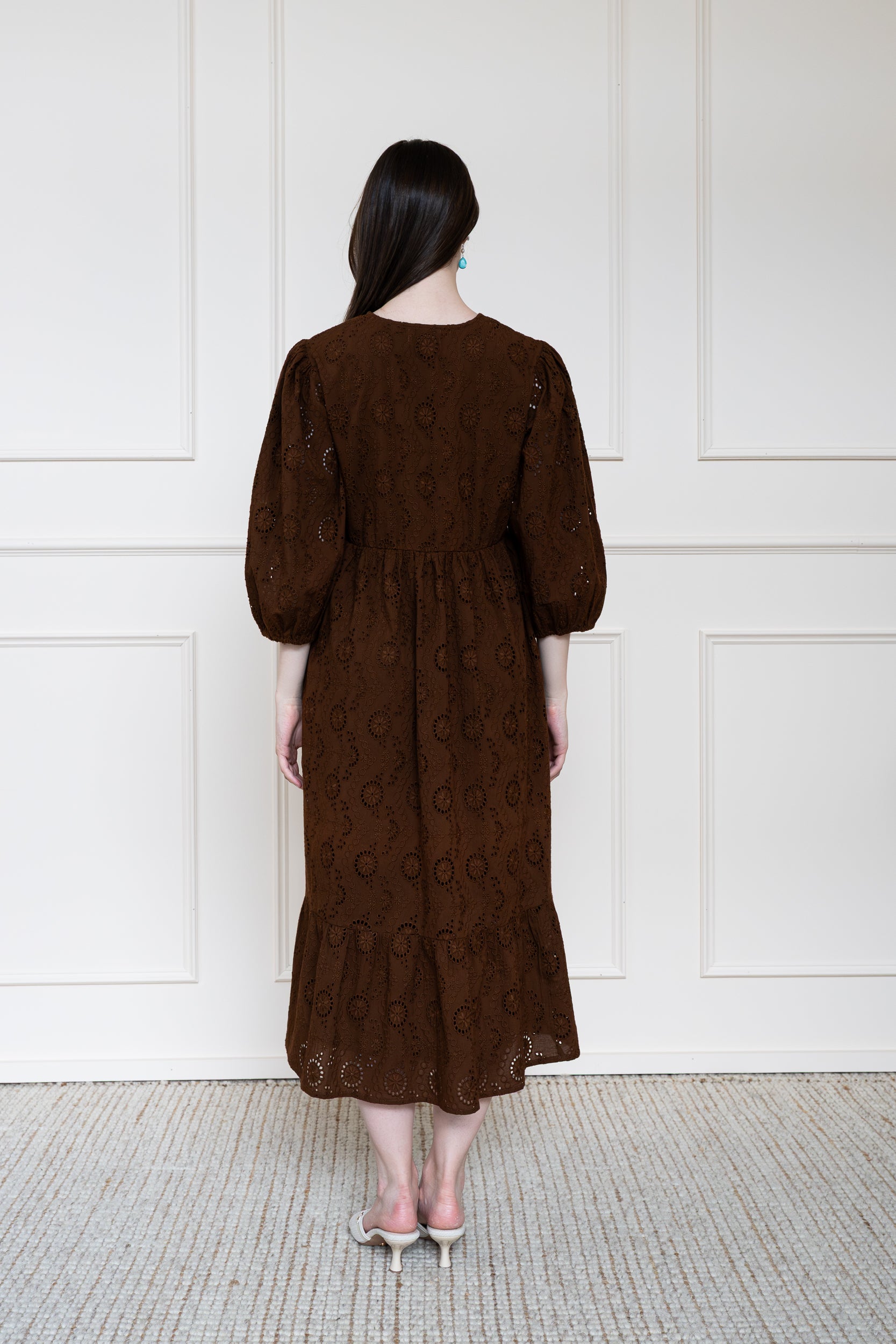 Back view of Tamarind Dress in Earth Rust showing flattering A-line silhouette and breathable organic cotton.