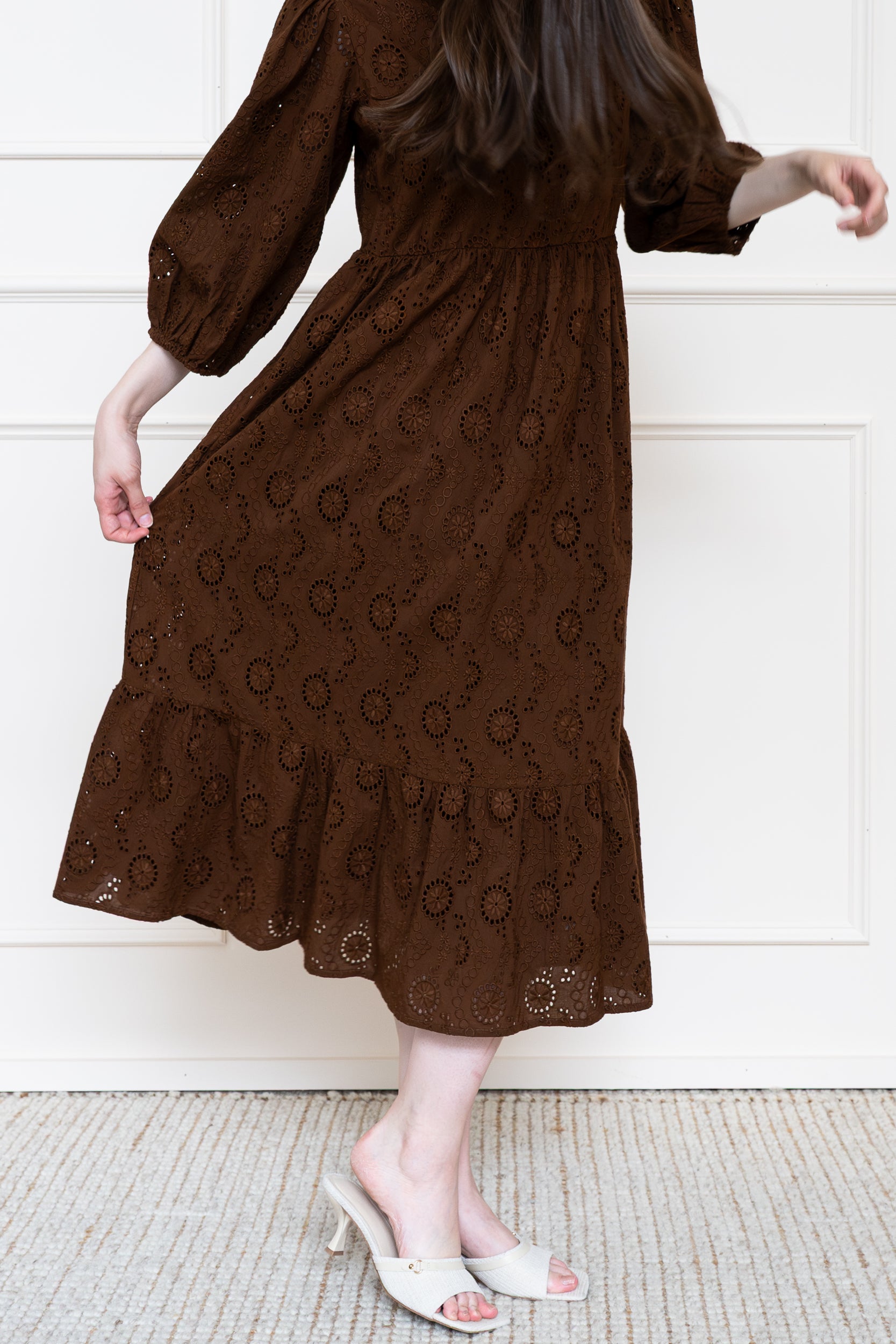 Tamarind Dress in Rust Brown showing flowing midi skirt suitable for autumn wedding guest or work dress.