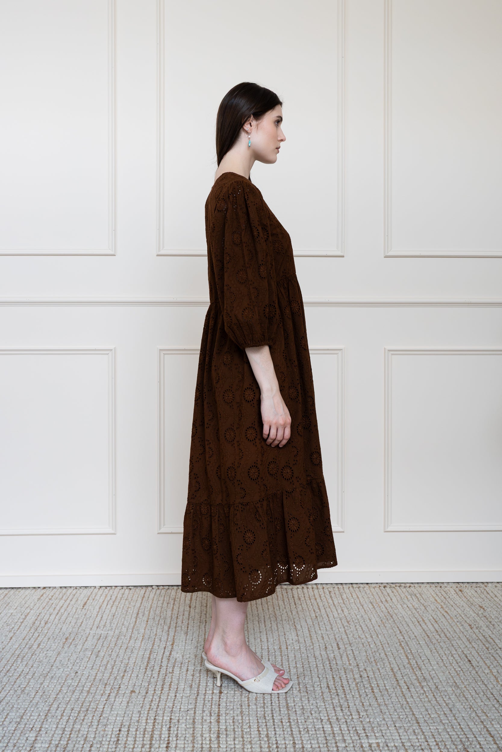 Side profile of Tamarind Dress showing elbow length sleeves and modest midi length fit.