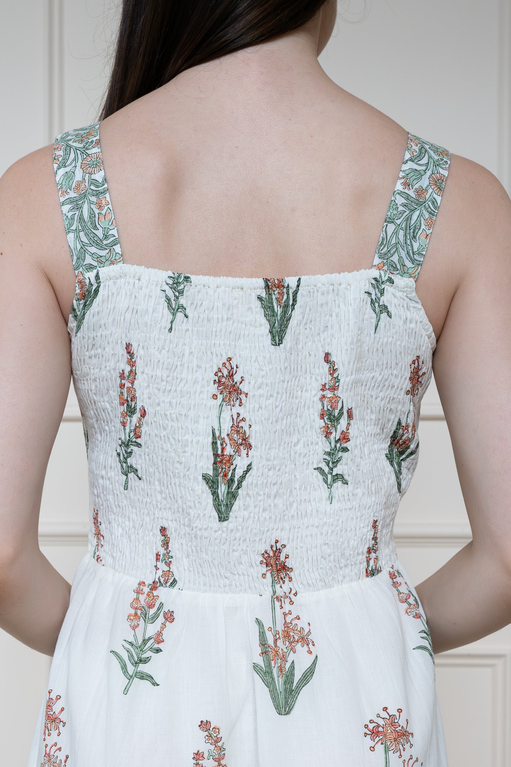 Close up back view of Whitsunday Dress showing adjustable straps and smocked back panel for comfortable fit