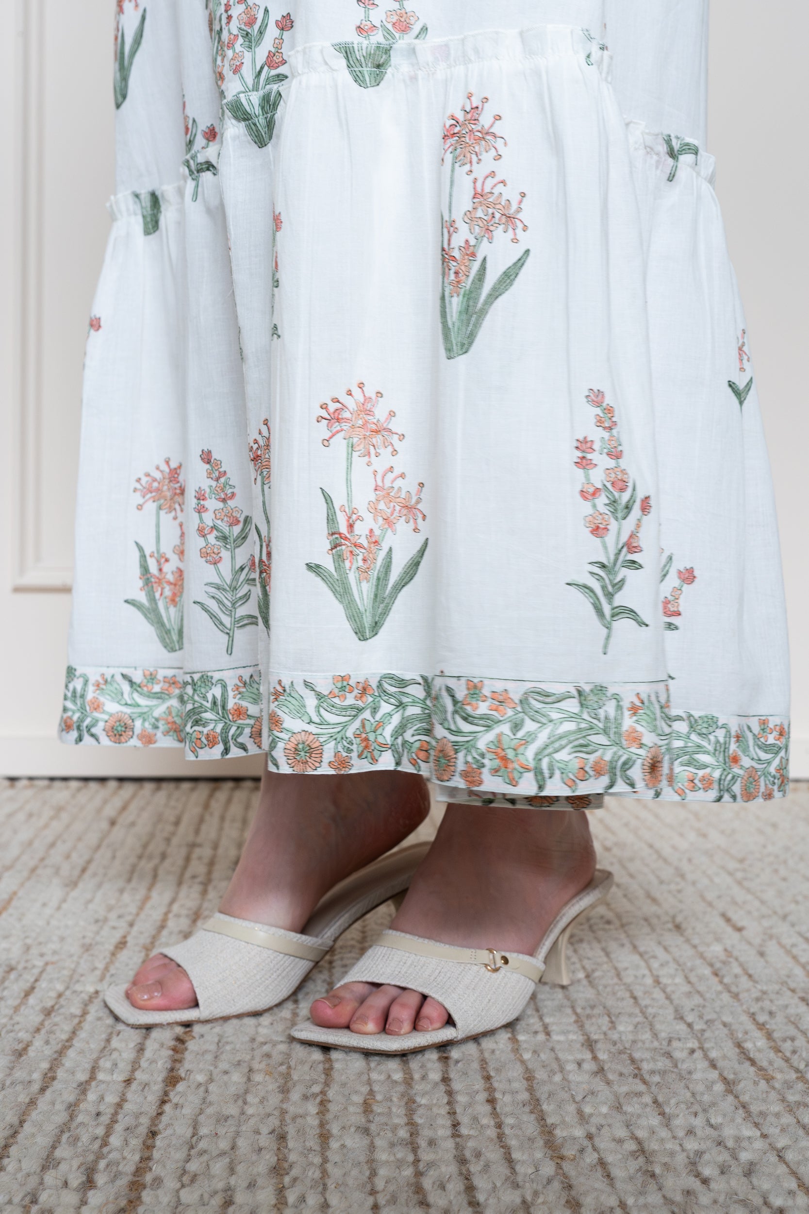 Close up of Whitsunday Dress tiered maxi skirt showing generous hem width and lightweight cotton drape.