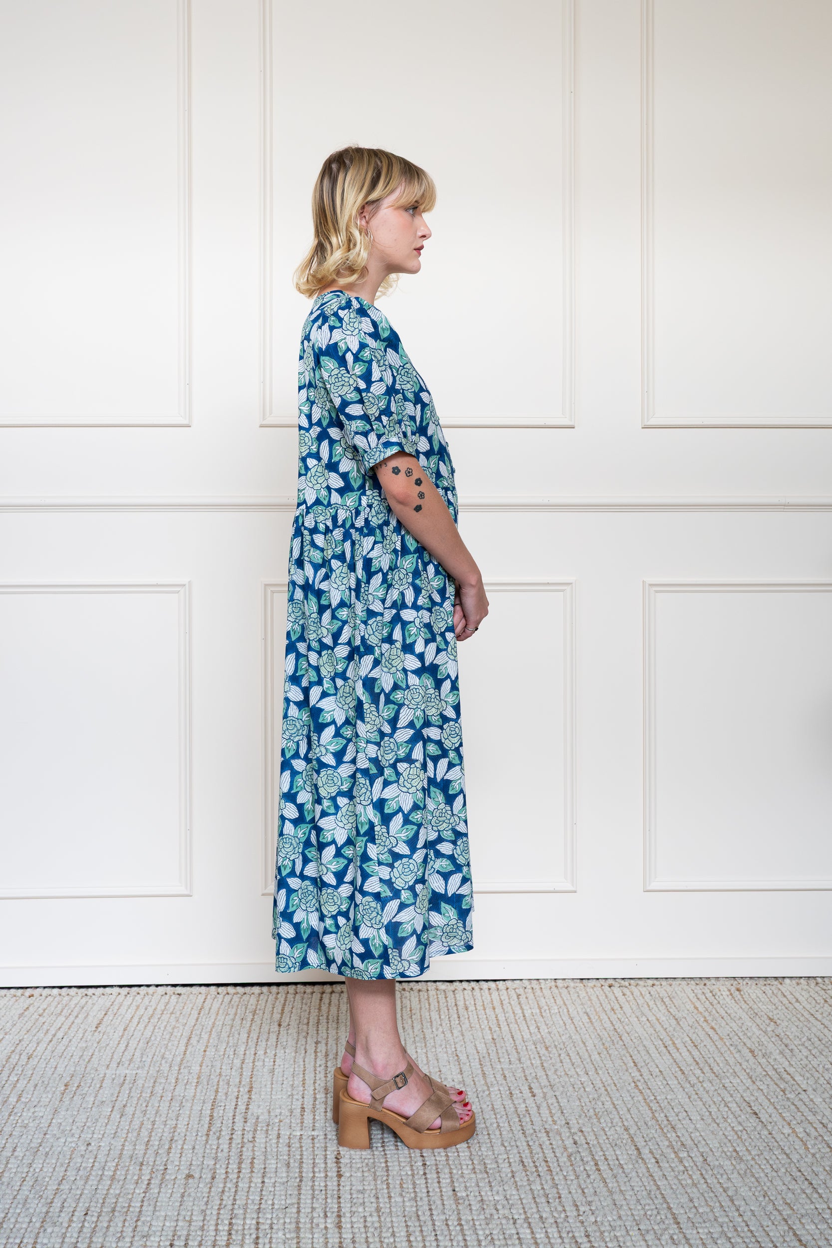 Side profile of Yarra Valley Dress showing elbow length sleeves and modest midi length fit.