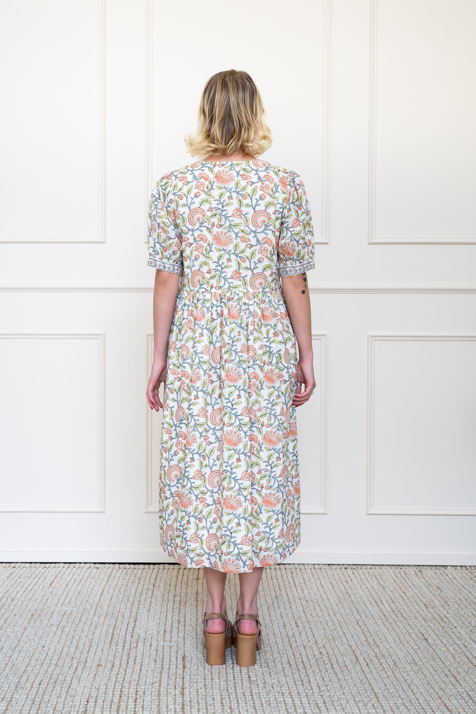 Back view of Yarra Valley Dress in white showing flattering A-line silhouette and breathable Indian organic cotton fabric.