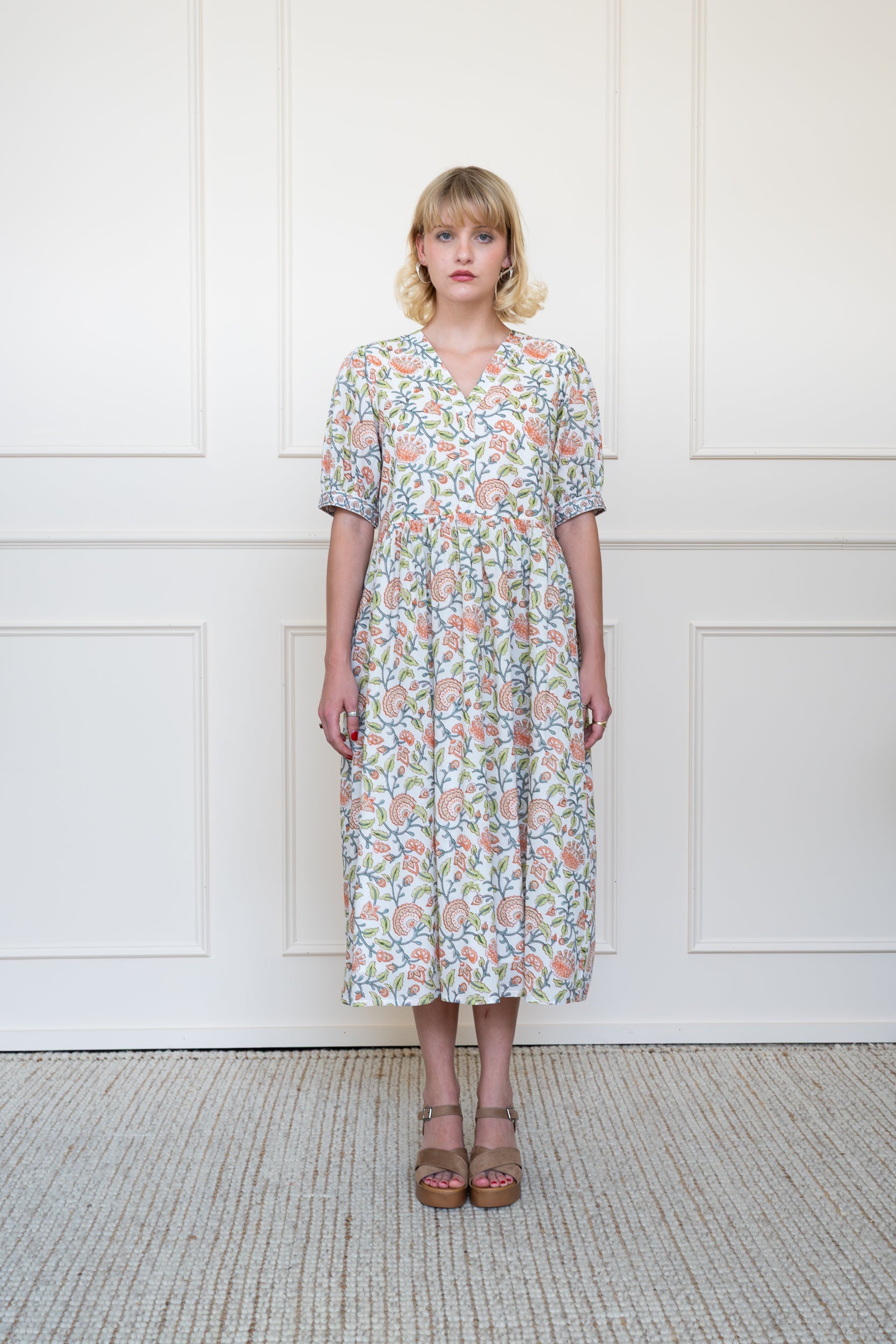 Yarra Valley Dress in Coral Garden showing flowing white midi skirt suitable for summer work dress or wedding guest.