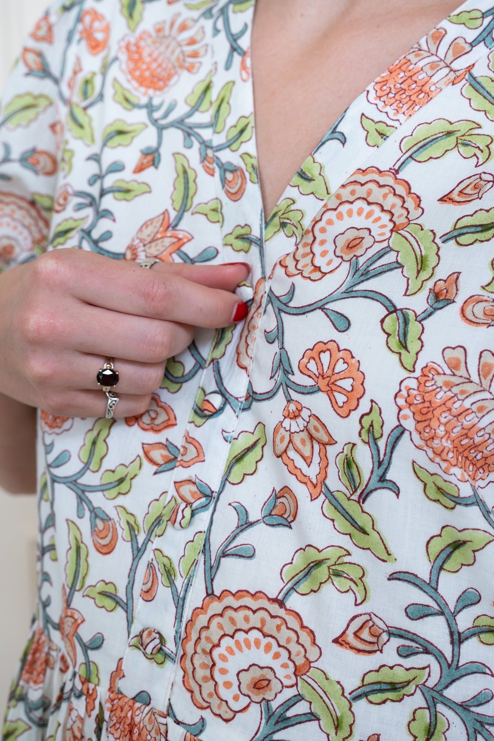 Close up front view of Yarra Valley Dress in Coral Garden showing neckline and floral print.