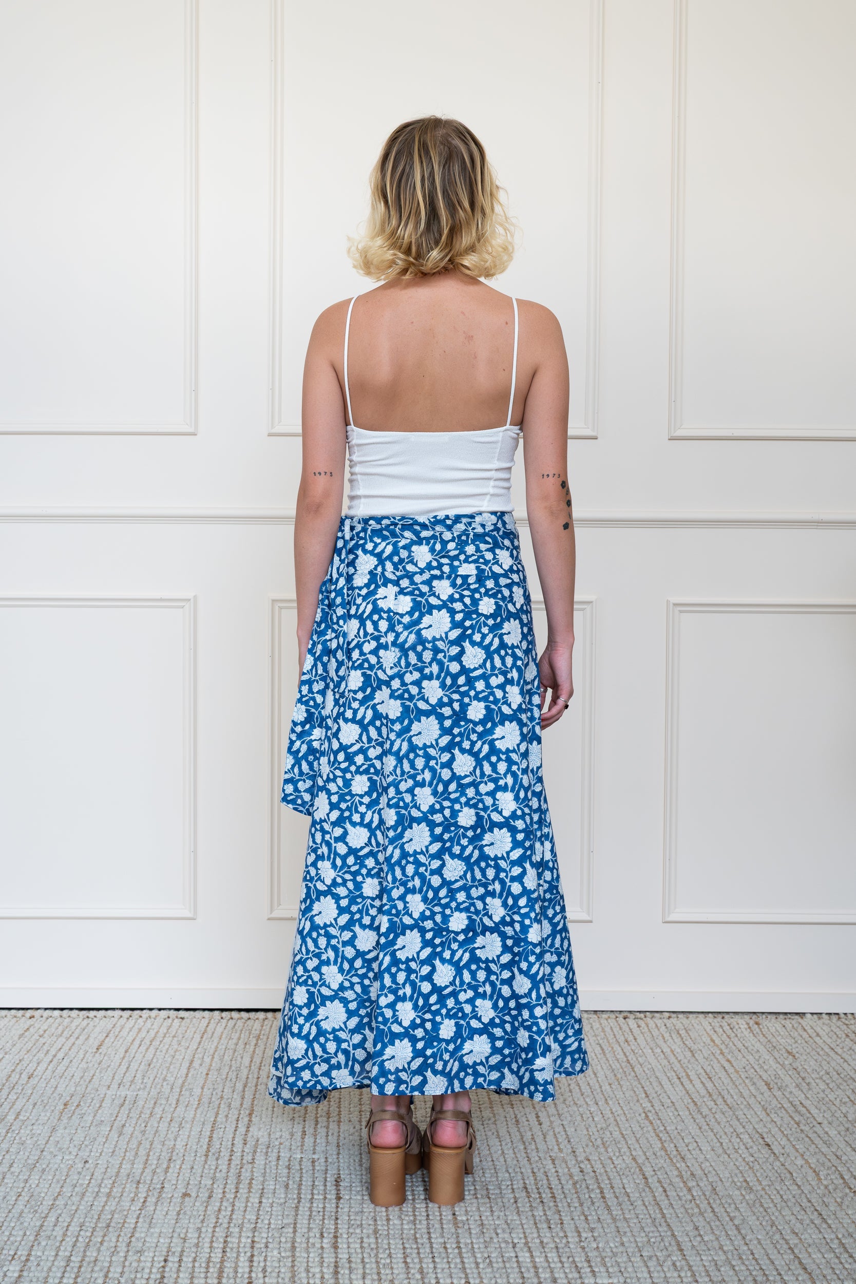 Back view of Flinders Skirt in Blue showing flattering waist fit and flowy hemline.