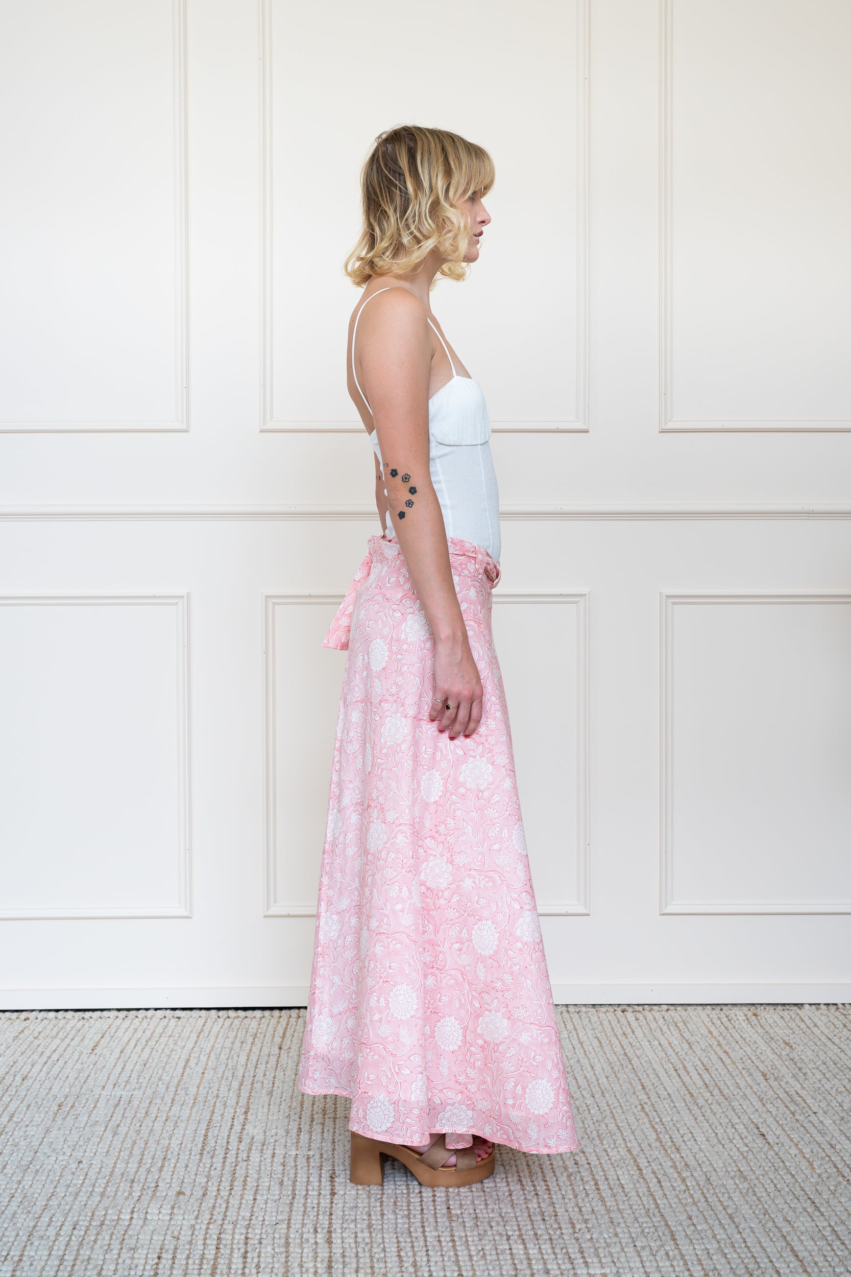 Side profile of Flinders Skirt in Apricot Sunset showing maxi length and floral hand block print.